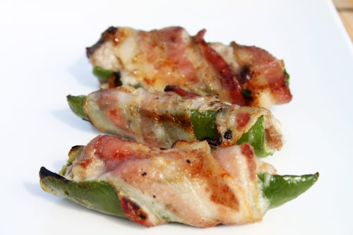 Grilled Jalapeno Peppers Stuffed with Turkey and Cheese and Wrapped in Bacon